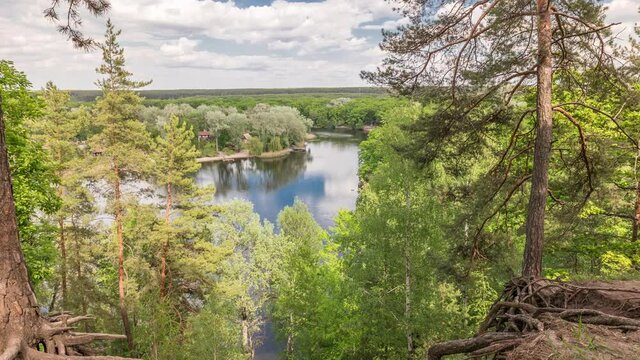 Aerial view on Severskij Donec river from Cossack Mountain timelapse in Kharkiv region, Ukraine. Tree roots and steep slope. Landscape panorama