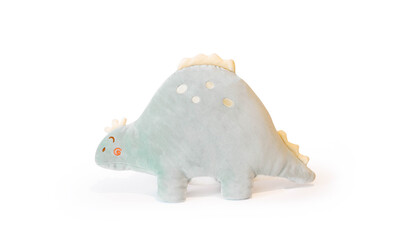 Soft light green plushie doll Stegosaurus dinosaur toy. Object isolated on white background with shadow reflection. The concept of gifts for the holidays. Toy in the shape of an animal. Side wiew