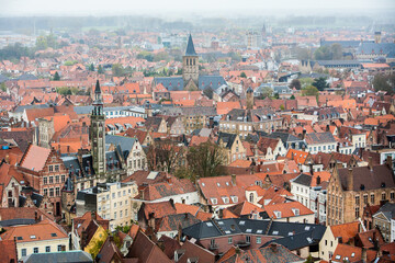 Naklejka na ściany i meble Bruges, Belgium; A high angle view of the crowded buildings in the city of Bruges.