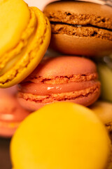 colorful macaroons on wooden table