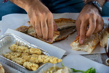 Close up man eating fish
