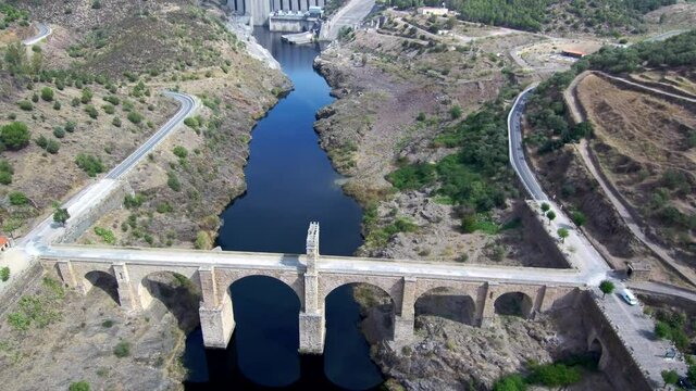 Aeria view of old bridge and beautiful landscape in a sunny day. Drone Footage