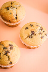 Group of homemade muffins with pieces of chocolate