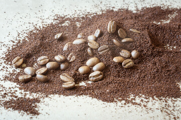 a scattering of ground coffee and coffee beans