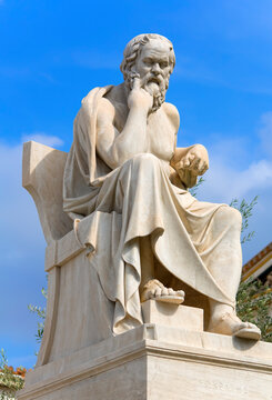 Socrates statue against blue sky