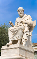 Plato statue against blue sky