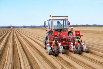 tractor with seeder in a field