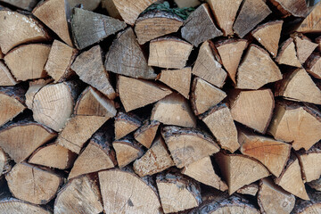stack of firewood. The firewood is neatly stacked
