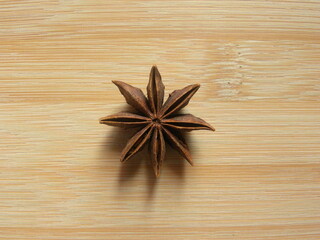 Brown color Star Anise fruit on wood background