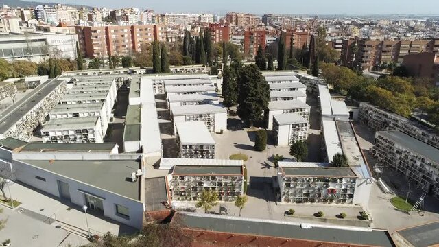 Aerial view of cemetery in the city. Drone Footage