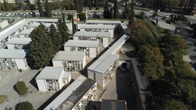 Aerial view of cemetery in the city. Drone Footage