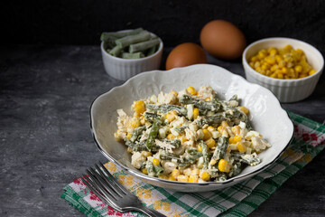 Salad with chicken, corn, cheese and eggs. Salad with mayonnaise .