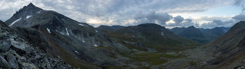 Amazing mountain landscape with colorful sky. Travel and hiking concept. Mountain landscape Subpolar Ural panorama.