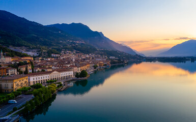 Fototapeta na wymiar Aerial view of Lake Iseo at sunrise, on the left the city of lovere which runs along the lake,Bergamo Italy.