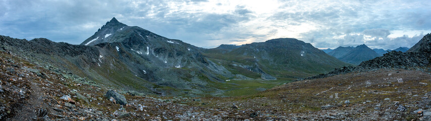 Amazing mountain landscape with colorful sky. Travel and hiking concept. Mountain landscape Subpolar Ural panorama.