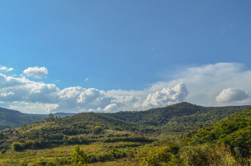 Fototapeta na wymiar View of the mountains across the horizon near a small town in Brazil.