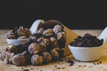 popcorn and chocolate in black background