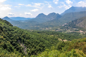 Obraz premium View of the valley in the Molise region, with plenty of greenery and large mountains around, Isernia province, Italy