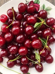 Ripe cherries in a white plate macro