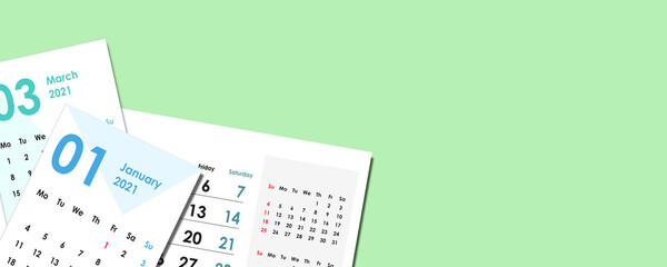 Calendar cards stacked on green pastel background. Illustration with a calendar and free space for your graphics or inscriptions. View from above. Flat lying composition. 