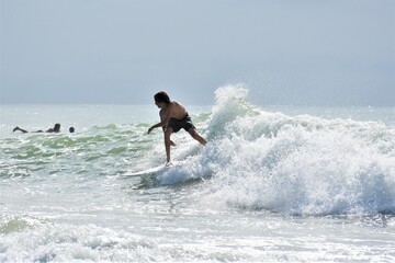 Surfer riding Surfing