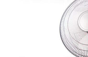 A silver fan cooling a room, on a very hot day and with a pure white background