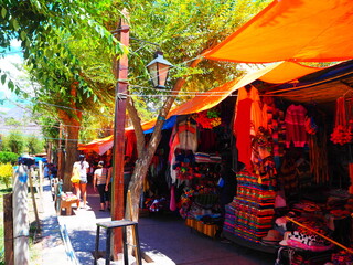 Market with Colorful fabrics and clothes in Tilcara, Quebrada de Humahuaca, Argentina