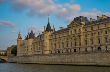 Fototapeta na wymiar Side wall of Conciergerie in Paris, France. Shot at a boat on Seine river.