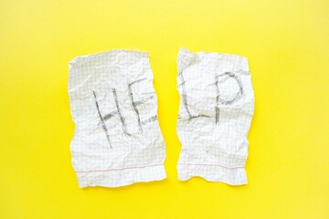 Text help on a white sheet of notebook in a cage on a bright yellow background. Step by step.