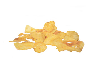 Potato chips poured from a bag lie on a white background. Macro shot