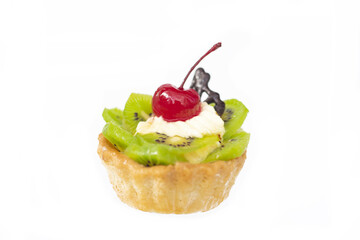 Cake with kiwi cherries and custard on white background