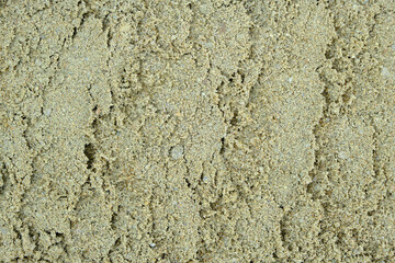 Texture, background of yellow sand on the beach.Building material.