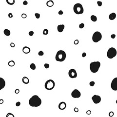 Doodle circles seamless pattern. Black dots texture background.