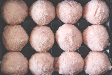 Raw cutlets in plastic brown packaging. Fast food products. Cooking