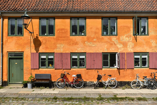 Orange house facace in Nyboder of historic houses district of former Naval barracks in Copenhagen, Denmark.