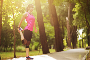 The young woman is engaged in sports fitness in nature forest Healthy fit living