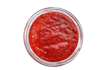 red tomato sauce in a glass bowl isolated on a white background, top view