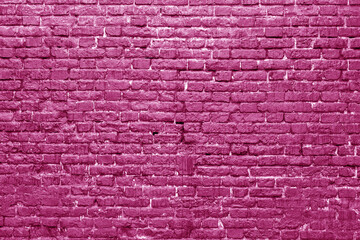 Pink brick wall. Loft interior design. Pink paint of the facade. Architectural background.