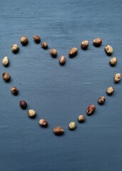 Heart / love shape character made from bambara groundnut with gray background