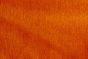 The texture of cotton linen carrot orange red color fabric texture background.
