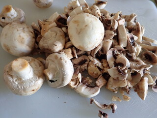 champignons on a white cutting board