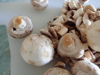 champignons on a white cutting board