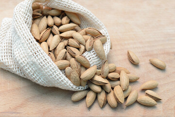 Almonds in shell, nuts in an eco-friendly bag