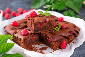 Homemade brownie pieces with raspberries and mint