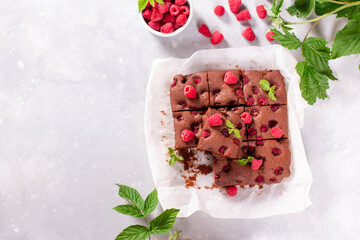 Chocolate brownies with raspberries and mint. Place for text