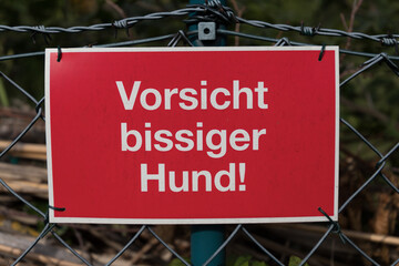sign with german inscription of Attention savage dog!