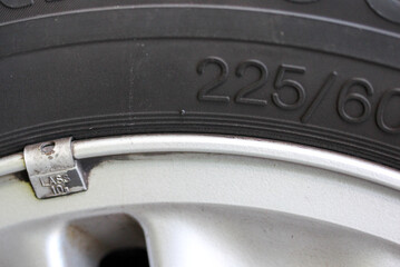 Old car wheel with balancing weight