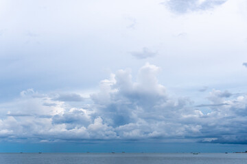 Naklejka na ściany i meble Bright Blue Sky with White Clouds for Background or Wallpapers.The Beauty of Tropical Nature, Thailand Beach, Sea Connect to the Sky.
