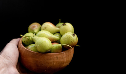 Ripe pears on a black background
