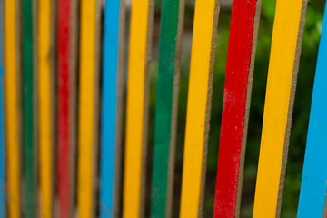 Colored sticks of wooden fence